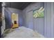 Basement with two doors and dragonfly art at 26 Twin Oaks Ln, Isle of Palms, SC 29451