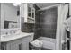 Bathroom with dark tile, a shower/tub combo, and a white vanity at 26 Twin Oaks Ln, Isle of Palms, SC 29451