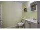 Small bathroom with white vanity, toilet and shower at 26 Twin Oaks Ln, Isle of Palms, SC 29451