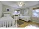 Bedroom with twin beds, hardwood floors, and a ceiling fan at 26 Twin Oaks Ln, Isle of Palms, SC 29451