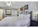 Spacious bedroom with a king-size bed, artwork, and hardwood floors at 26 Twin Oaks Ln, Isle of Palms, SC 29451