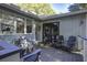 Spacious deck with comfortable seating, adjacent to home's entrance at 26 Twin Oaks Ln, Isle of Palms, SC 29451