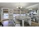Bright dining area with farmhouse table and bench seating, and access to the kitchen at 26 Twin Oaks Ln, Isle of Palms, SC 29451