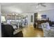 Bright dining area with a farmhouse table and views to the kitchen at 26 Twin Oaks Ln, Isle of Palms, SC 29451