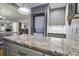 Modern kitchen with granite countertops and stackable washer/dryer at 26 Twin Oaks Ln, Isle of Palms, SC 29451