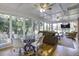 Sunroom with glass walls, comfortable seating and a view at 26 Twin Oaks Ln, Isle of Palms, SC 29451