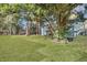 Lush green backyard with mature trees offering shade and privacy for outdoor enjoyment at 2675 Houston St, North Charleston, SC 29405