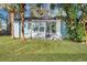 Charming home with a well-manicured lawn and inviting outdoor space framed by palm trees at 2675 Houston St, North Charleston, SC 29405