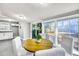 Bright dining area with a round table and chairs set by large windows and a sliding glass door at 2675 Houston St, North Charleston, SC 29405