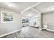 Spacious living room featuring gray flooring, ample natural light, and an open floor plan at 2675 Houston St, North Charleston, SC 29405