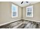 Bright bedroom featuring two windows and modern flooring, providing natural light and stylish design at 2754 Houston St, North Charleston, SC 29405