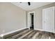 Cozy bedroom showcasing a neutral color palette, door, and modern flooring, creating a welcoming atmosphere at 2754 Houston St, North Charleston, SC 29405