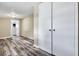 View of bedroom and hallway featuring wood-look floors and a double-door closet for ample storage space at 2754 Houston St, North Charleston, SC 29405