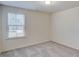 Bright, carpeted bedroom with window providing natural light at 144 Seaton Street, Summerville, SC 29486