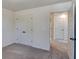 Bedroom with carpet, doors to bathroom and closet at 144 Seaton Street, Summerville, SC 29486