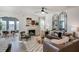 Bright living room featuring a fireplace, stylish decor, and comfortable seating for relaxation and entertainment at 144 Seaton Street, Summerville, SC 29486
