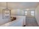 Bright loft area with stylish light fixture, plush carpeting, and ample natural light at 144 Seaton Street, Summerville, SC 29486