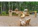 Community playground with multiple play structures and benches surrounded by a beautifully wooded area at 144 Seaton Street, Summerville, SC 29486