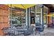 Outdoor seating at a restaurant with yellow umbrellas offering a casual dining experience at 208 Sumter Ave, Summerville, SC 29483