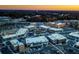 Aerial view of mixed use development with commercial buildings, parking lot and residential apartments at 347 Trailmore Ln, Summerville, SC 29486