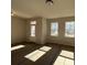 Bright living room featuring windows and a door, offering plenty of natural light at 5138 Double Eagle Loop, Summerville, SC 29485