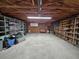 Large garage with ample shelving and storage cabinets offering great potential for organization and projects at 7024 E Constellation Dr, North Charleston, SC 29418