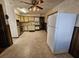 Spacious kitchen with wooden cabinets, tile flooring, and white appliances, offering functionality at 7024 E Constellation Dr, North Charleston, SC 29418