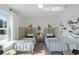 Comfortable bedroom featuring two twin beds, neutral decor, with a sunlit window view at 762 Meadowbrook Ln, Summerville, SC 29486