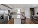 Open kitchen features stainless appliances, granite countertops, and an island with barstool seating at 764 Meadowbrook Ln, Summerville, SC 29486