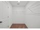Walk-in closet with ample wire shelving and neutral carpet flooring at 764 Meadowbrook Ln, Summerville, SC 29486