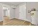 Bright unfinished basement area with light wood flooring, storage, and neutral paint throughout at 2265 Bailey Dr, North Charleston, SC 29405