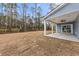 Backyard features a covered patio with ceiling fan and spacious grassy area at 5874 Hwy 165, Ravenel, SC 29470