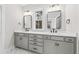 Bathroom featuring a double vanity with framed mirrors and modern fixtures at 5874 Hwy 165, Ravenel, SC 29470