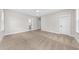 Bright bedroom with neutral walls, carpet, and ensuite bathroom access at 5874 Hwy 165, Ravenel, SC 29470