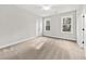 Bedroom features two windows allowing natural light and neutral carpet at 5874 Hwy 165, Ravenel, SC 29470