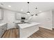 Modern kitchen with stainless steel appliances, granite countertops and stylish pendant lighting at 5874 Hwy 165, Ravenel, SC 29470