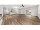 Open-concept living space with kitchen, fireplace, and luxury vinyl flooring providing a seamless living experience at 5874 Hwy 165, Ravenel, SC 29470