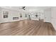 Spacious living room with luxury vinyl flooring and a modern fireplace for a cozy and inviting atmosphere at 5874 Hwy 165, Ravenel, SC 29470