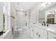 Bright bathroom with bath tub, white vanity and modern fixtures at 5876 Hwy 165, Ravenel, SC 29470