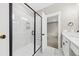Bathroom shower with glass doors, and a large sink vanity in a neutral color palette at 5876 Hwy 165, Ravenel, SC 29470