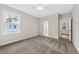 Bedroom featuring neutral carpet, a ceiling fan, and an ensuite bathroom entrance at 5876 Hwy 165, Ravenel, SC 29470
