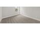 Bedroom showcasing neutral color palette, window with view, and clean white trim at 5876 Hwy 165, Ravenel, SC 29470