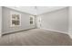 Bright bedroom featuring neutral carpet, a large window and entry to ensuite bathroom at 5876 Hwy 165, Ravenel, SC 29470