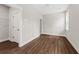 Bright bedroom features hardwood floors, neutral paint, closet, and lots of natural light at 5876 Hwy 165, Ravenel, SC 29470