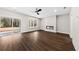 Bright living room with sliding glass doors, a modern fireplace, and hardwood floors at 5876 Hwy 165, Ravenel, SC 29470