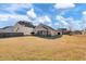 Large backyard with screened porch and neighborhood view at 1112 Moss Grove Dr, Moncks Corner, SC 29461