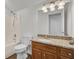 Bathroom with granite countertop, wooden vanity, and tub at 1112 Moss Grove Dr, Moncks Corner, SC 29461