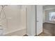 Bathroom with tub, vinyl flooring, and access to bedroom at 1112 Moss Grove Dr, Moncks Corner, SC 29461