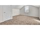 Empty bedroom with brown carpet, white door and window at 1112 Moss Grove Dr, Moncks Corner, SC 29461