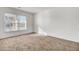 Bright bedroom with brown carpet and a large window at 1112 Moss Grove Dr, Moncks Corner, SC 29461